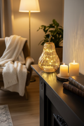 Amber Glass Light Up Pear in a cosy living room