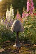Cast Iron Mushroom nestled in lush British cottage garden