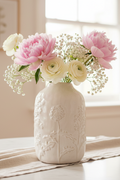 Flower Design White Vase with soft floral arrangement in bright setting